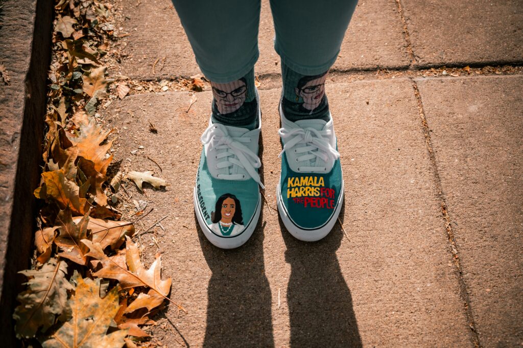 Woman wearing Kamala Harris sneakers.